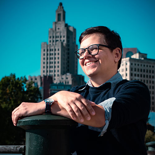 Headshot of Court with the Providence skyline in the background